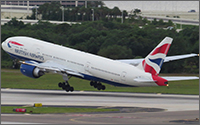 A white plane, labeled British Airways, lifting off a runway.