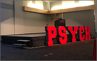 A auditorium with bold letter spelling PSYCH across the front