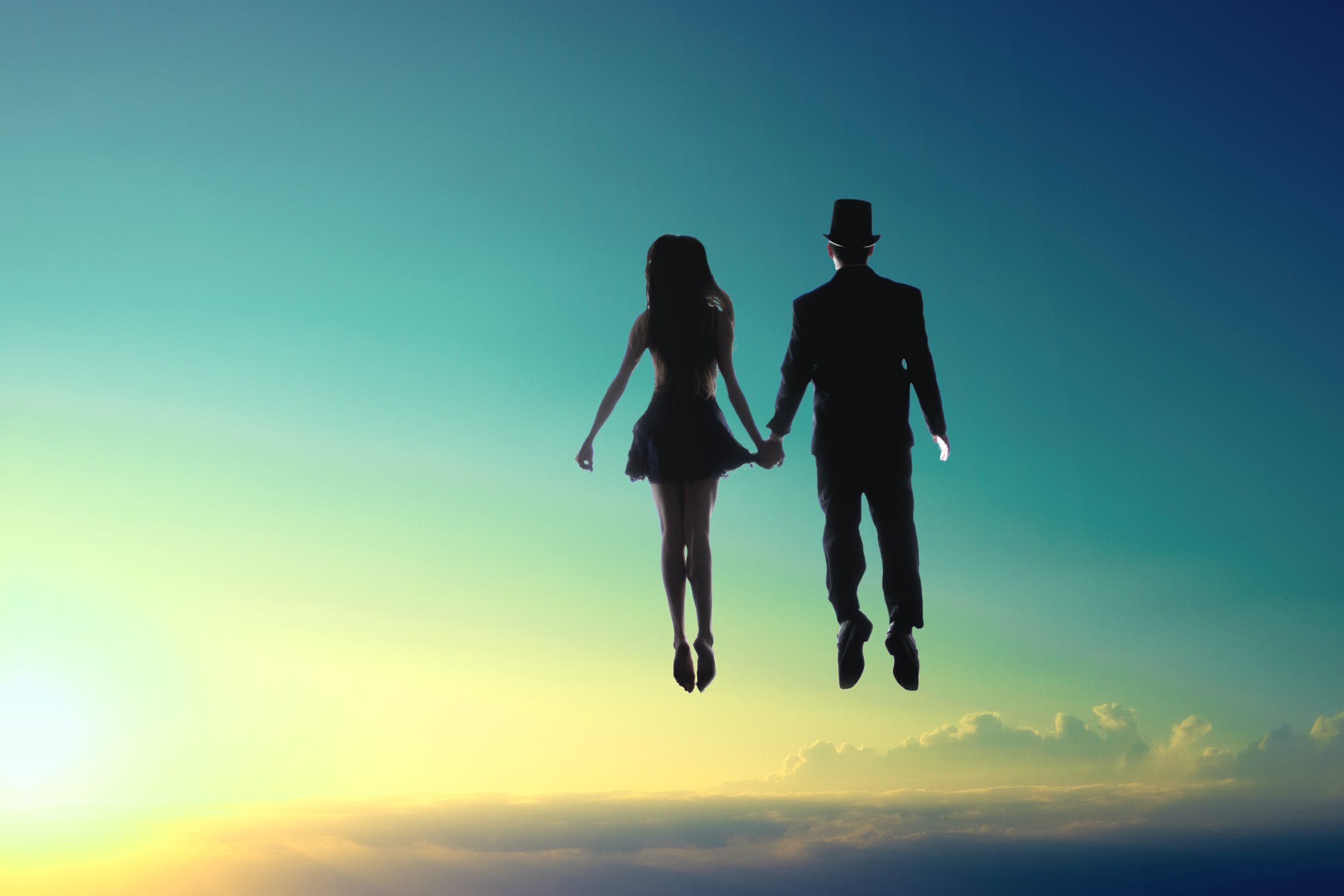 Man and woman floating in the sky
